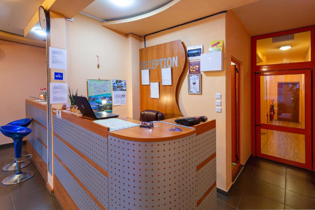 a room with a reception desk in a building at Family Hotel Jemelly in Obzor