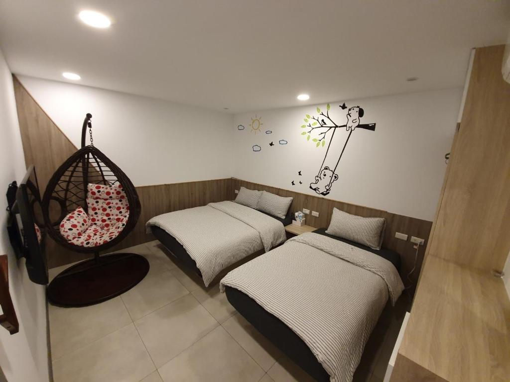 Postel nebo postele na pokoji v ubytování Chingya House