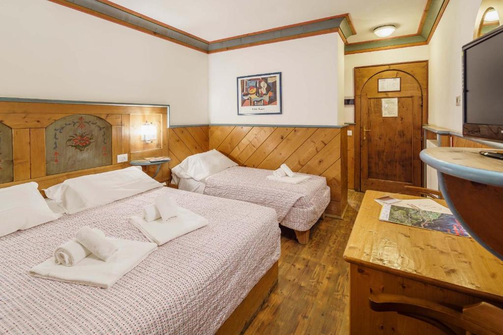 Postel nebo postele na pokoji v ubytování Hotel Alemagna