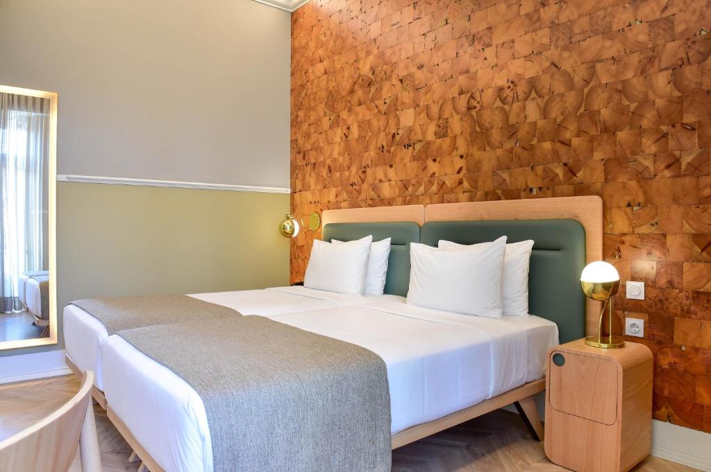 Un ou plusieurs lits dans un hébergement de l'établissement My Story Hotel Tejo