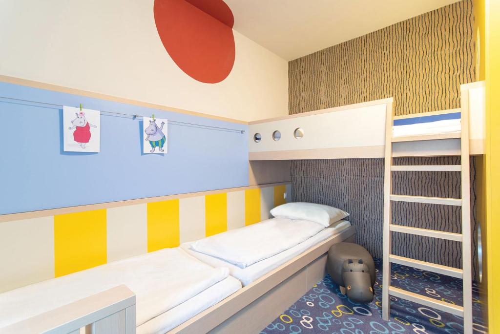 Postel nebo postele na pokoji v ubytování Kolping Family Resort