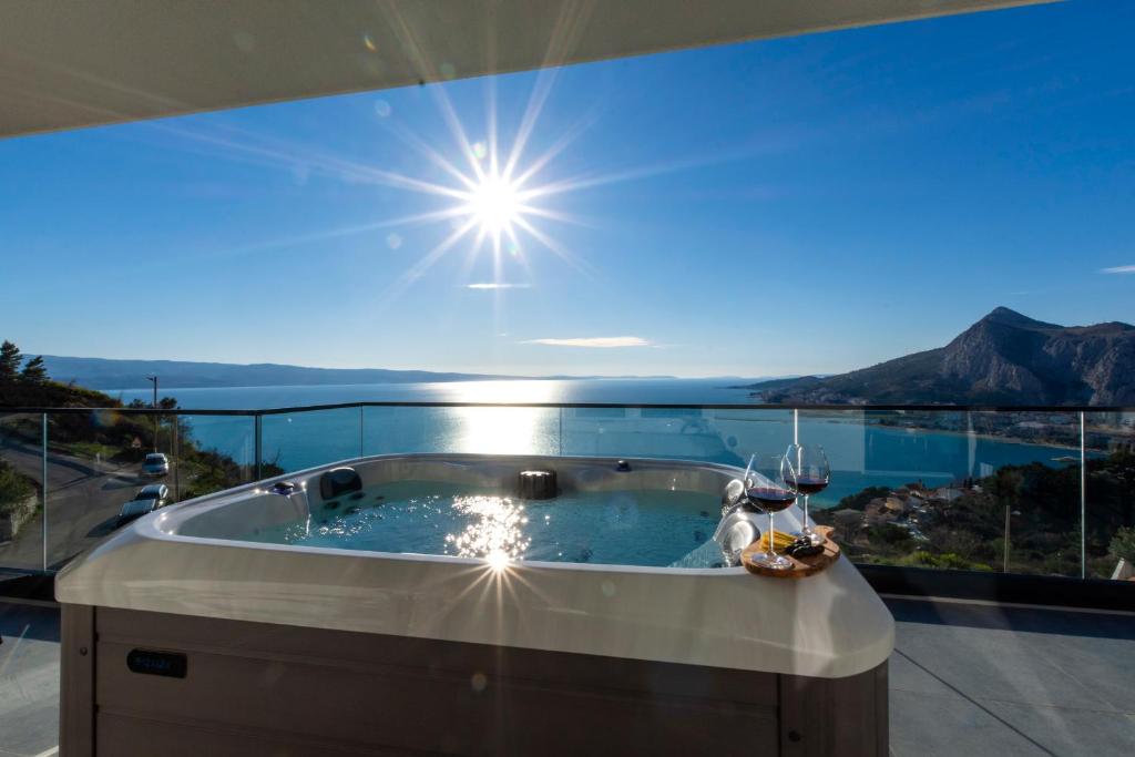 a jacuzzi tub in a house with a view at Lucy in Omiš