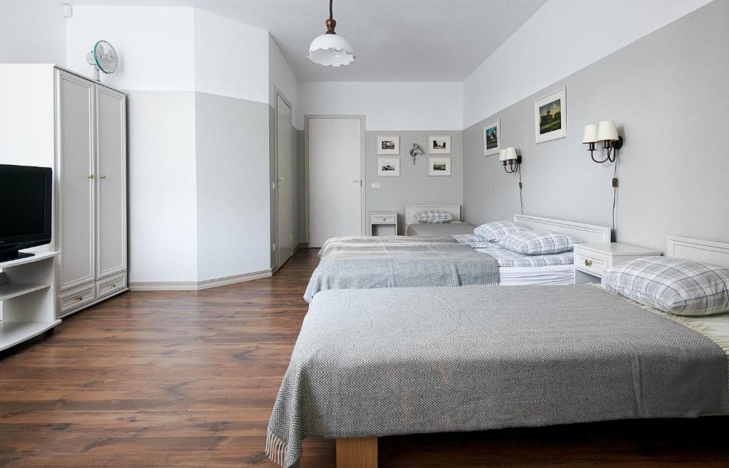 Postel nebo postele na pokoji v ubytování Promenaadi Villa