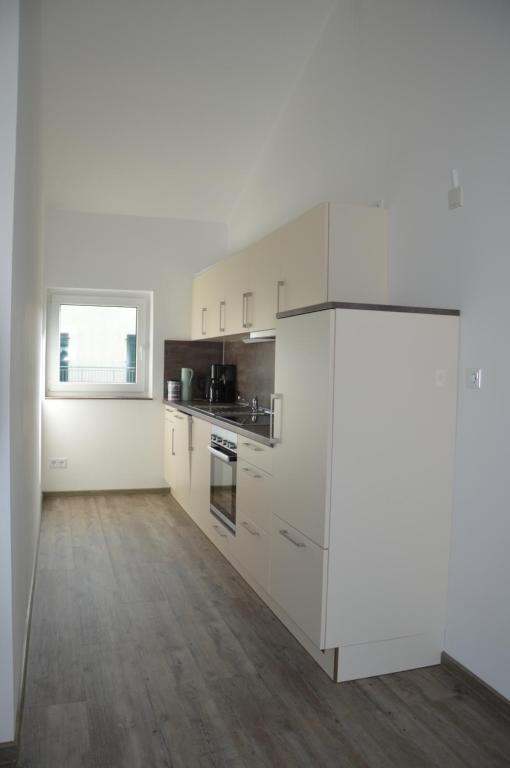 Kuchyň nebo kuchyňský kout v ubytování Wein & Gästehaus Porten-Becker