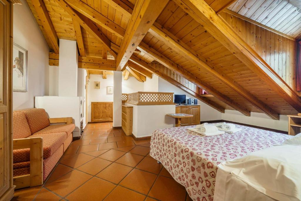 Postel nebo postele na pokoji v ubytování Hotel Alemagna