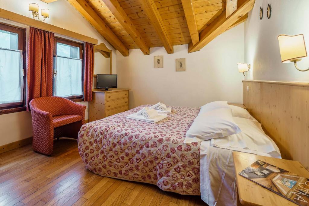 Postel nebo postele na pokoji v ubytování Hotel Alemagna