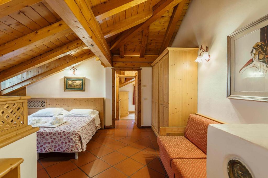 Postel nebo postele na pokoji v ubytování Hotel Alemagna