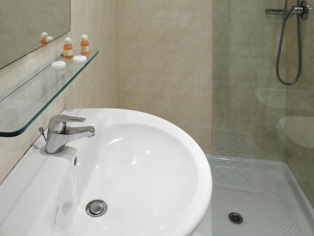 Koupelna v ubytování Hotel Corallo