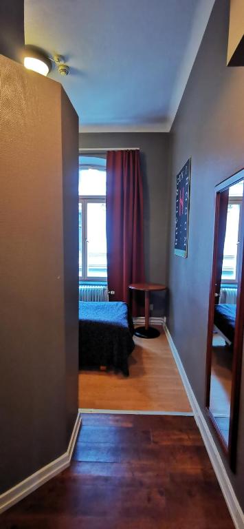 Postel nebo postele na pokoji v ubytování Sundsvall City Hotel