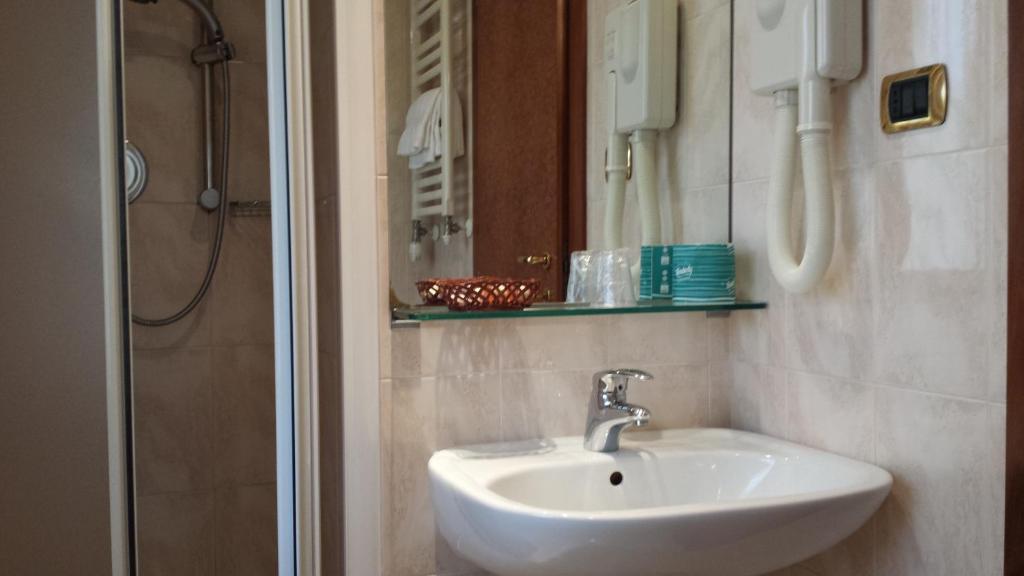 Koupelna v ubytování Hotel Corallo