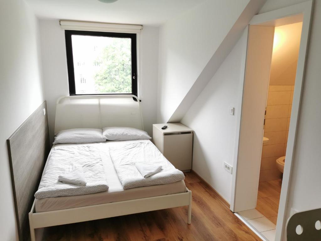 Postel nebo postele na pokoji v ubytování Rooms Ambrožič