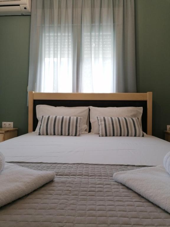 A bed or beds in a room at Green Island Residence