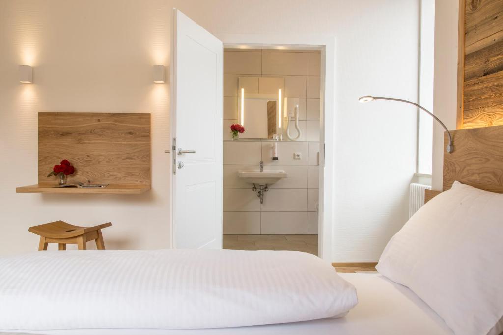 Postel nebo postele na pokoji v ubytování Hotel Vötterl