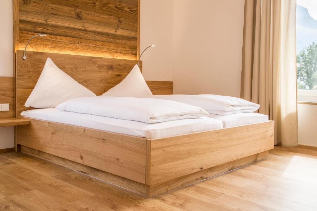 Postel nebo postele na pokoji v ubytování Hotel Vötterl