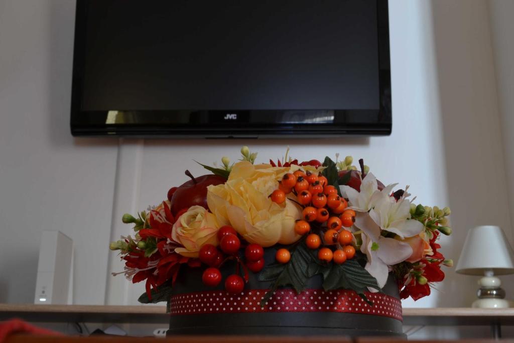 Televízia a/alebo spoločenská miestnosť v ubytovaní Paprika Apartment Grand