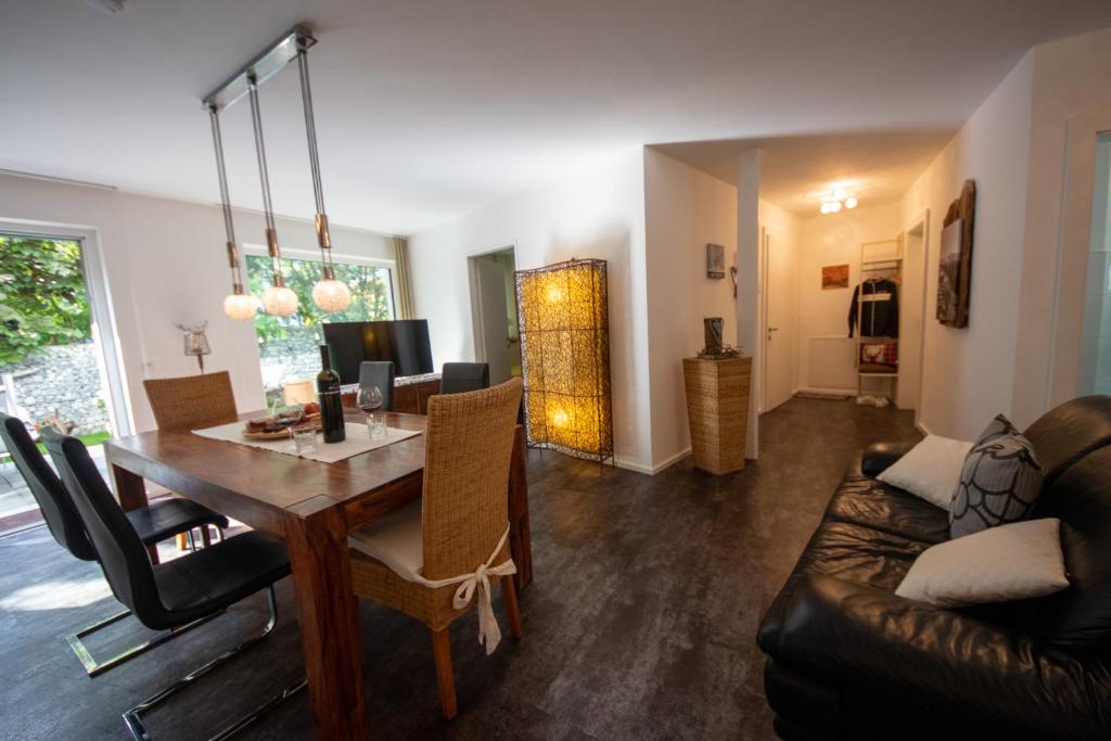 a living room with a table and a couch at Apartment LANDECK-CITY in Landeck