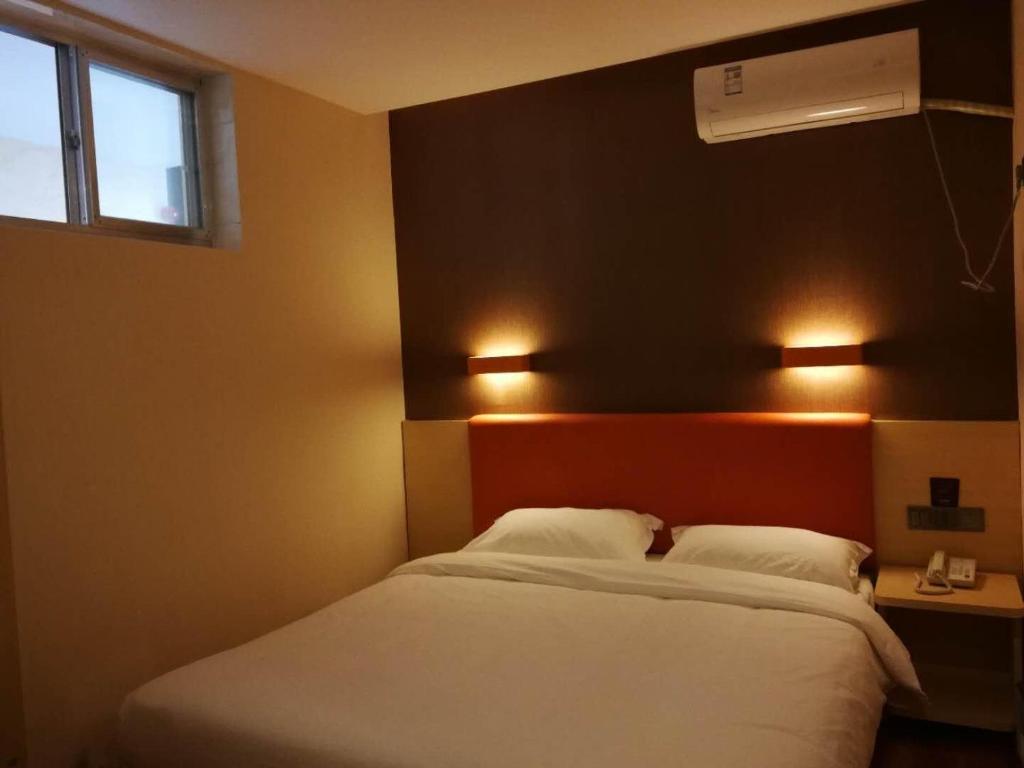 Ένα ή περισσότερα κρεβάτια σε δωμάτιο στο 7Days Premium Laizhou City Government Branch