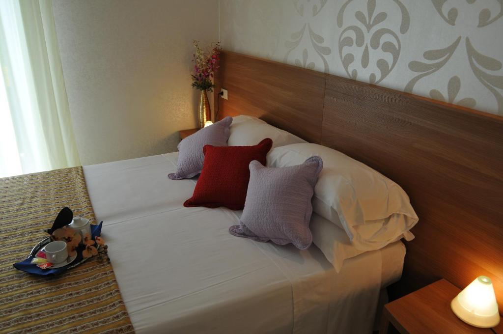 Postel nebo postele na pokoji v ubytování Hotel Arabel