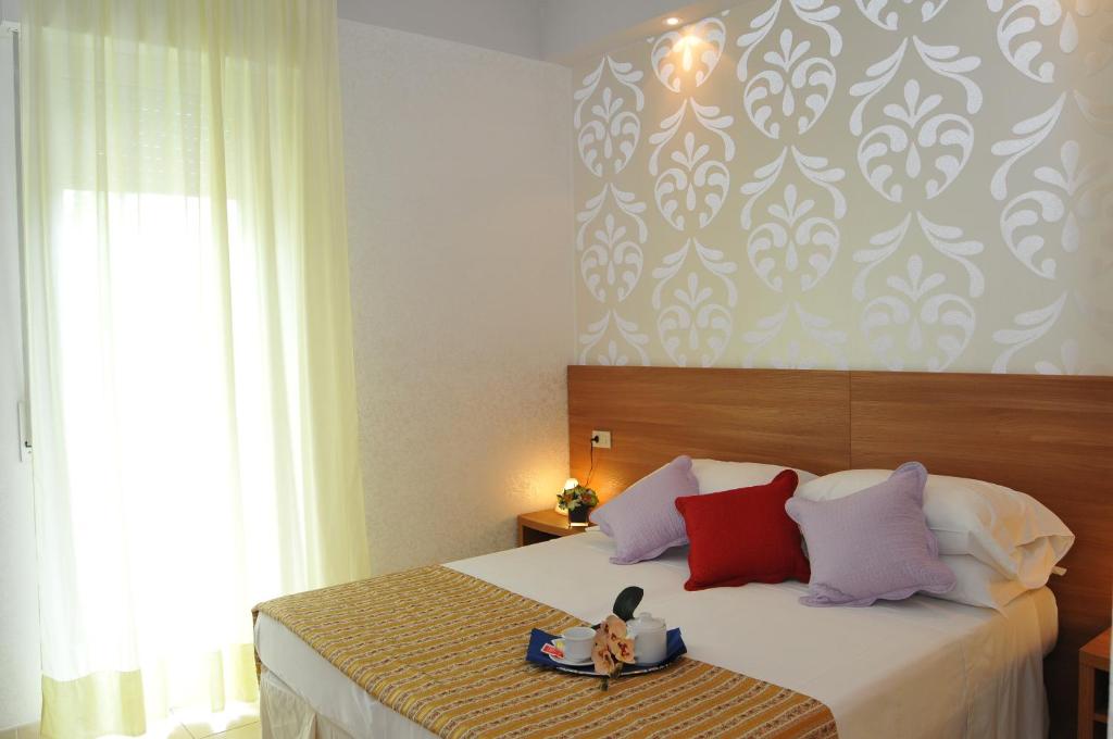 Postel nebo postele na pokoji v ubytování Hotel Arabel