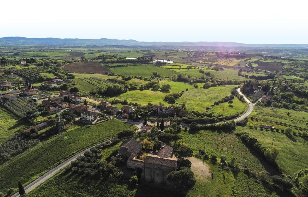 an aerial view of an old castle in a green field at Hotel Ristorante Farneta in Cortona