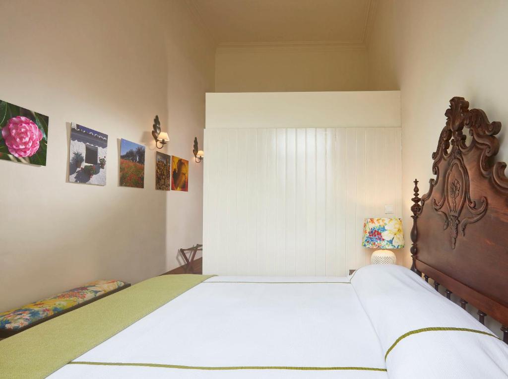 Postel nebo postele na pokoji v ubytování Casadacidade