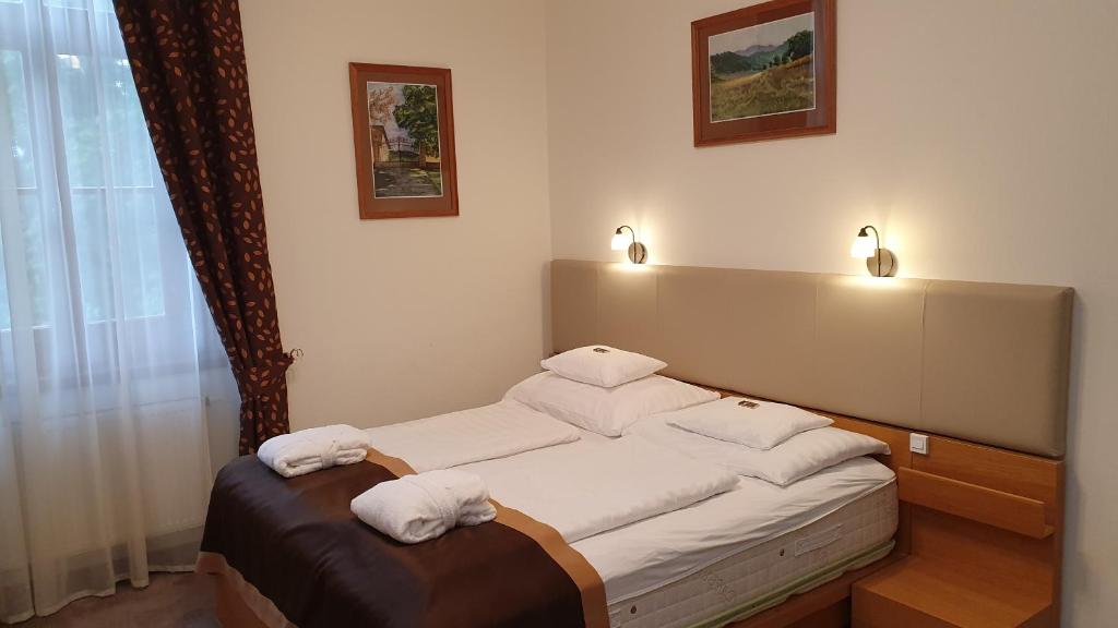 Posteľ alebo postele v izbe v ubytovaní Főnix Wellness Resort