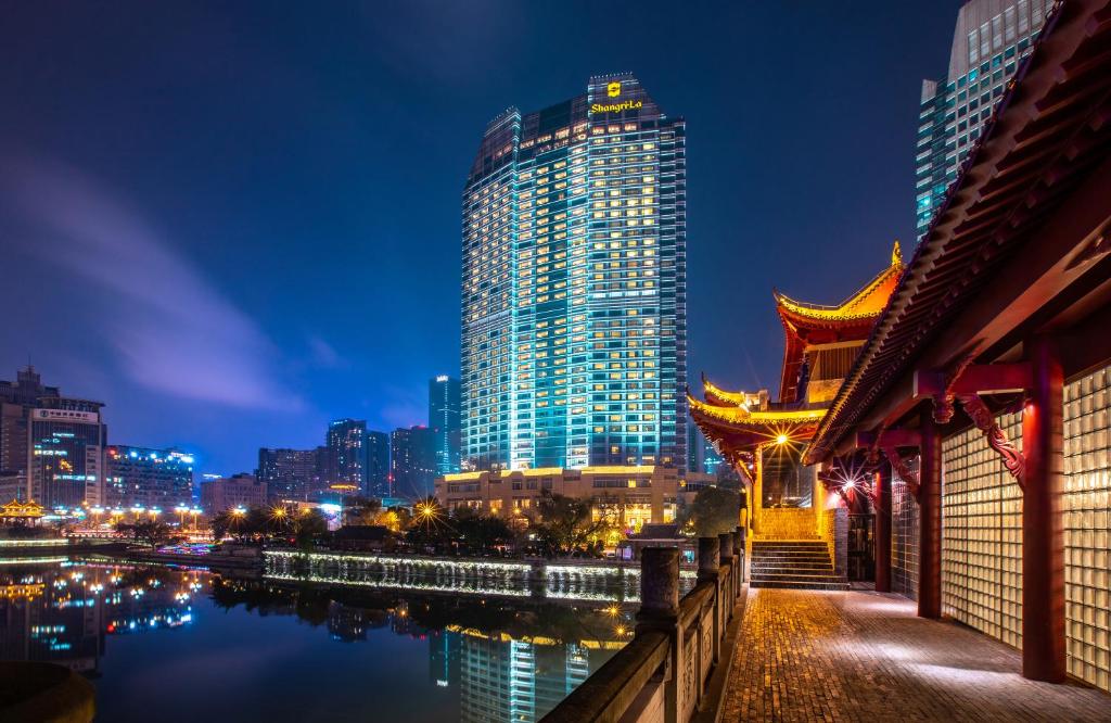 a view of a city skyline at night at Shangri-La Chengdu in Chengdu