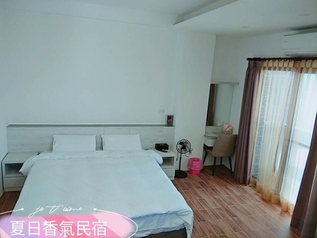 Postel nebo postele na pokoji v ubytování Penghu Summer Aroma Homestay