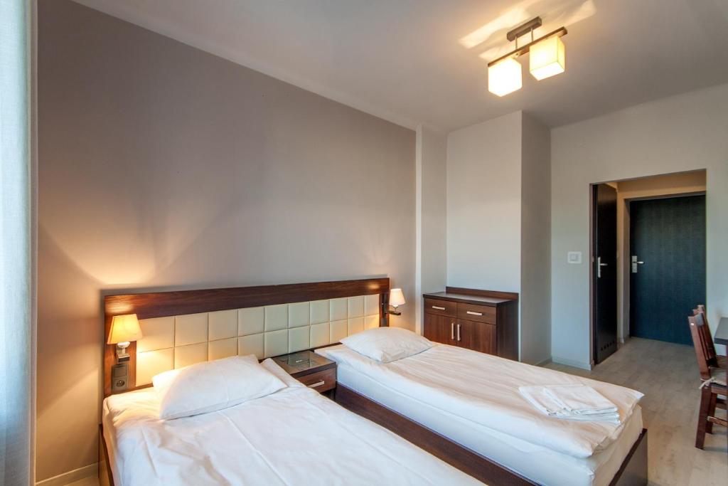 Posteľ alebo postele v izbe v ubytovaní Avion Hotel
