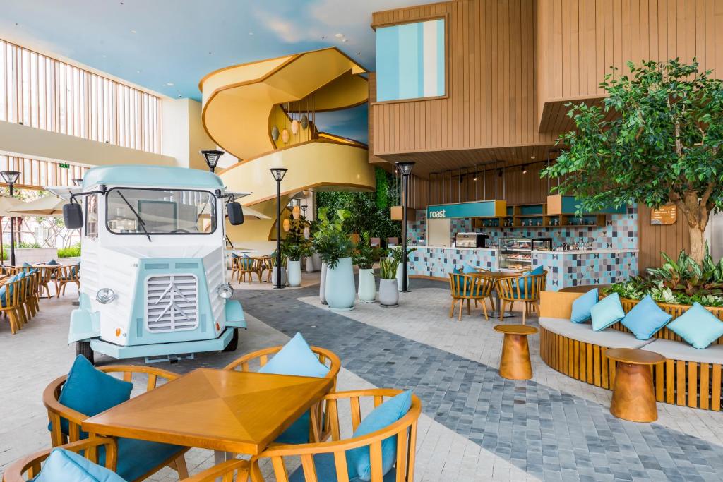 a food truck parked in front of a restaurant at Fusion Suites Vung Tau in Vung Tau