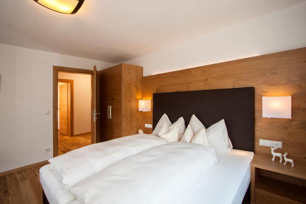 Postel nebo postele na pokoji v ubytování Apartmenthaus Juen
