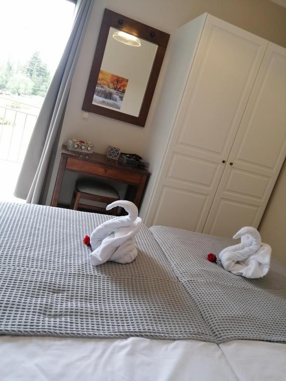 Łóżko lub łóżka w pokoju w obiekcie TA DIDYMAKIA APARTMENTS.