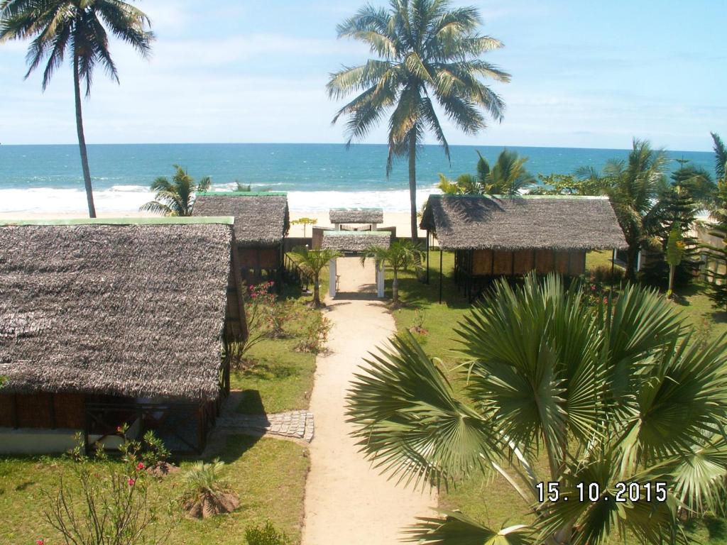 an aerial view of a resort with the beach at 4 bedrooms house at Toamasina 50 m away from the beach with sea view and enclosed garden in Toamasina