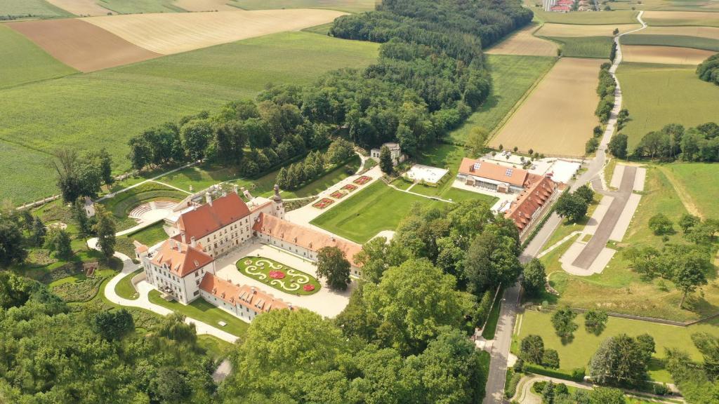 an aerial view of a building with a garden at Schloss Thalheim in Sankt Pölten