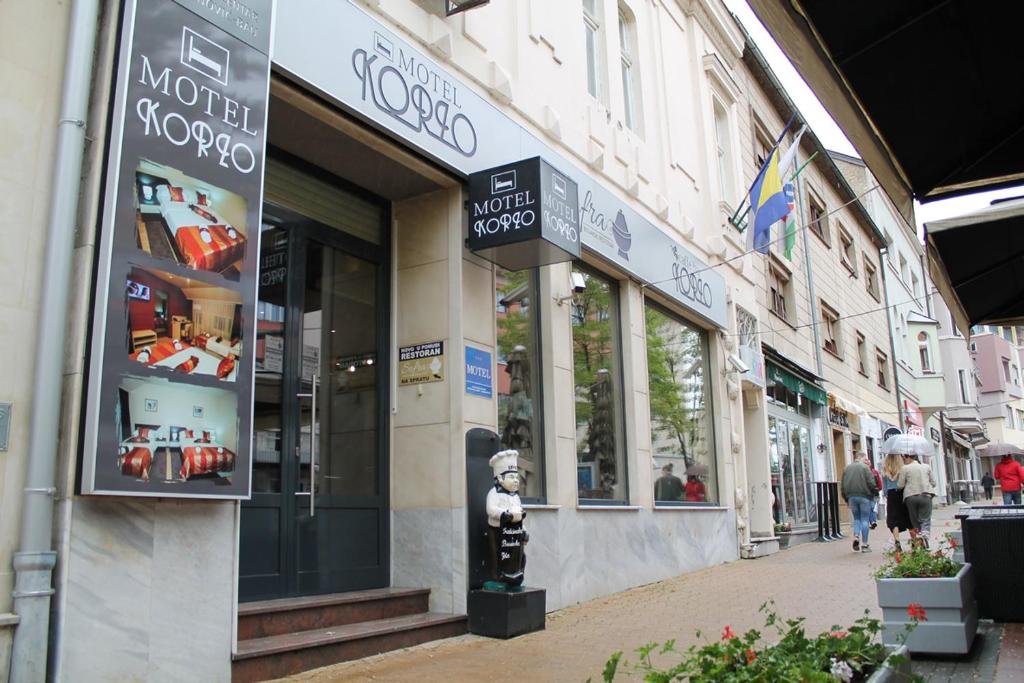 a store on a city street with a store at Motel Korzo in Bihać