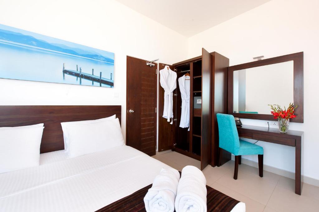 Postel nebo postele na pokoji v ubytování The Beach Apartments