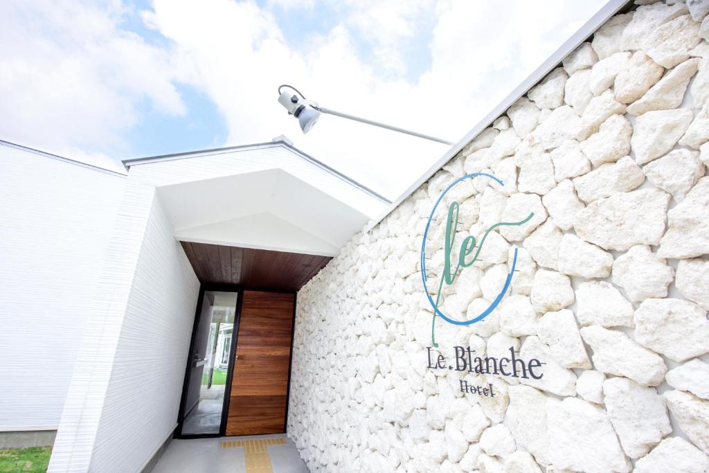 a building with a sign on the side of it at Le.Blanche in Minamiawaji