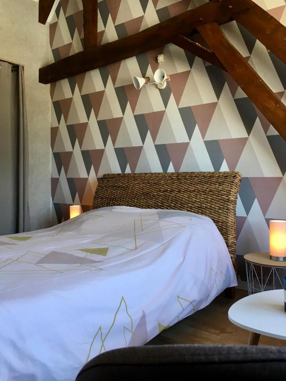 Postel nebo postele na pokoji v ubytování Chambres dhotes a la ferme