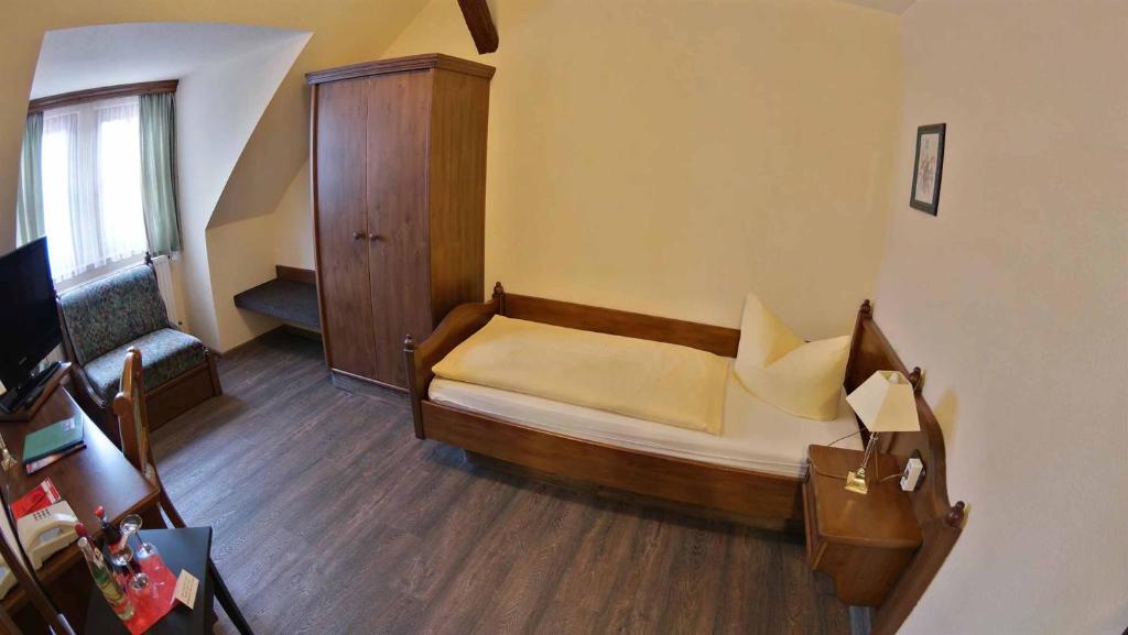 Postel nebo postele na pokoji v ubytování Hotel und Restaurant Rittergut Kreipitzsch