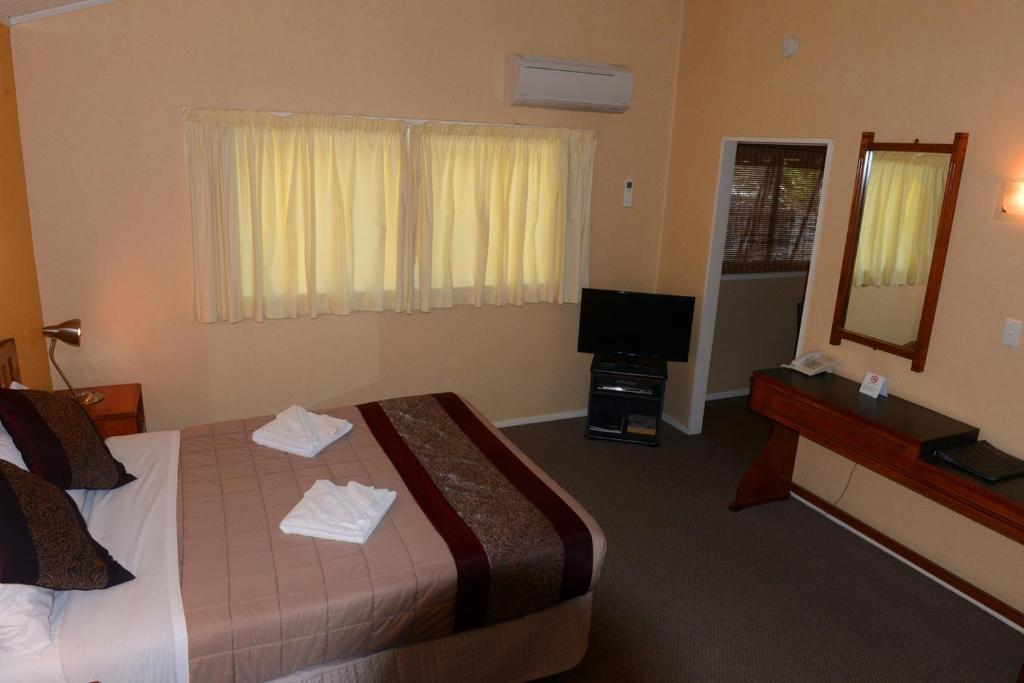Postel nebo postele na pokoji v ubytování Classic Motel