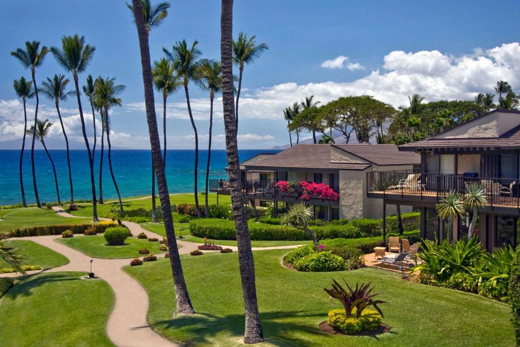 an aerial view of a house with palm trees at Wailea Elua Village - CoralTree Residence Collection in Wailea