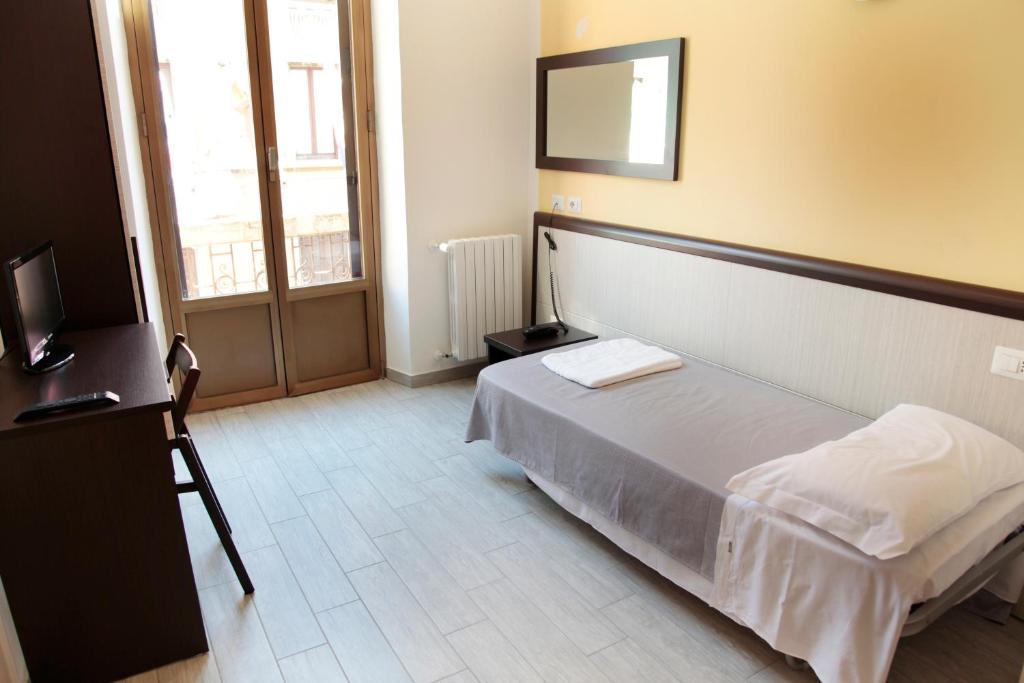 Postel nebo postele na pokoji v ubytování HOTEL Poma