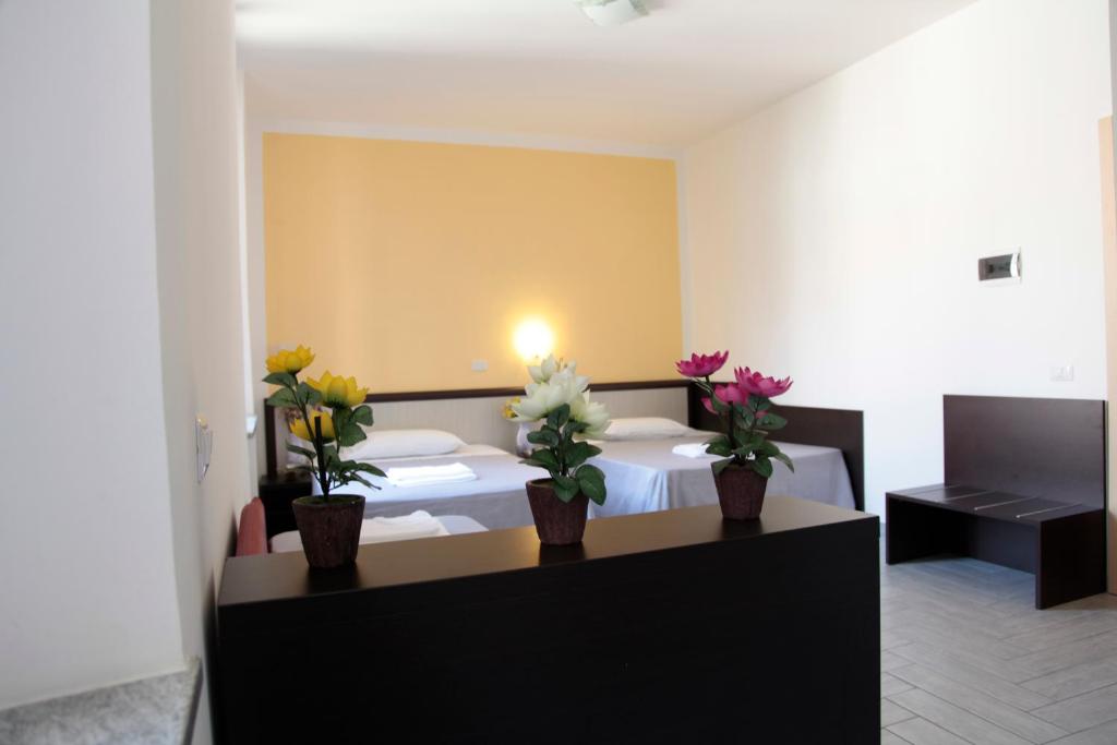 Postel nebo postele na pokoji v ubytování HOTEL Poma