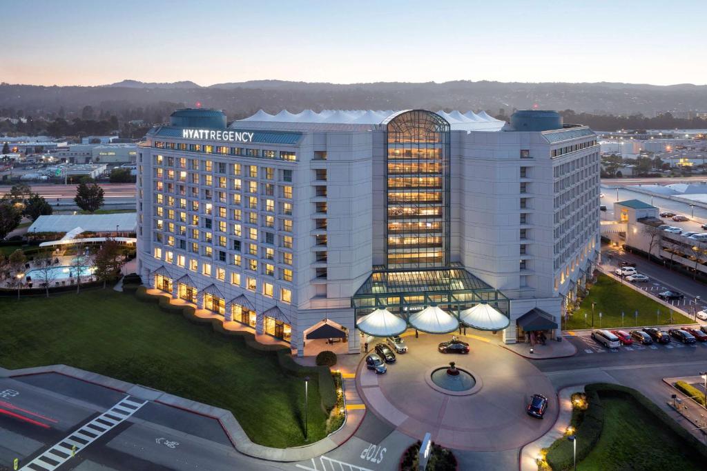 an aerial view of a hotel building with a parking lot at Hyatt Regency San Francisco Airport in Burlingame