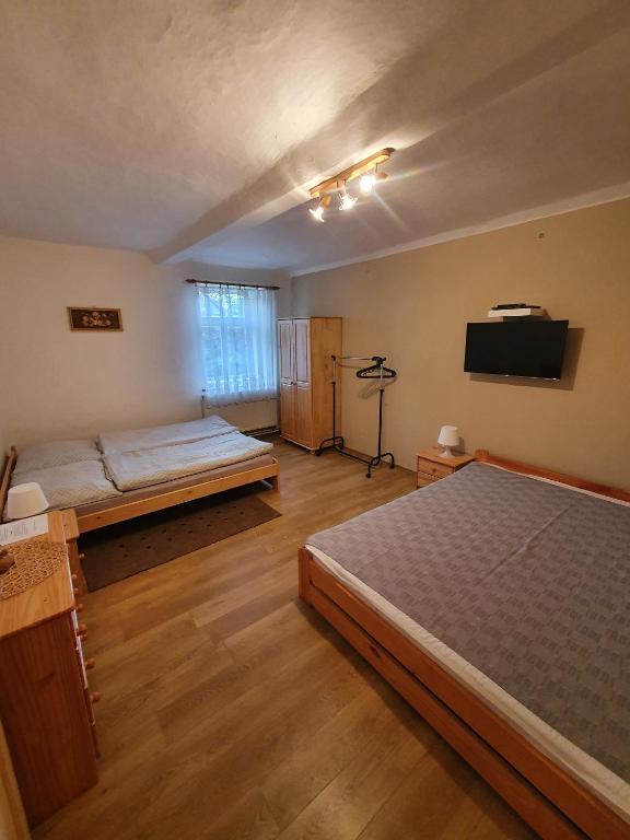 Postel nebo postele na pokoji v ubytování Chalupa Vesec