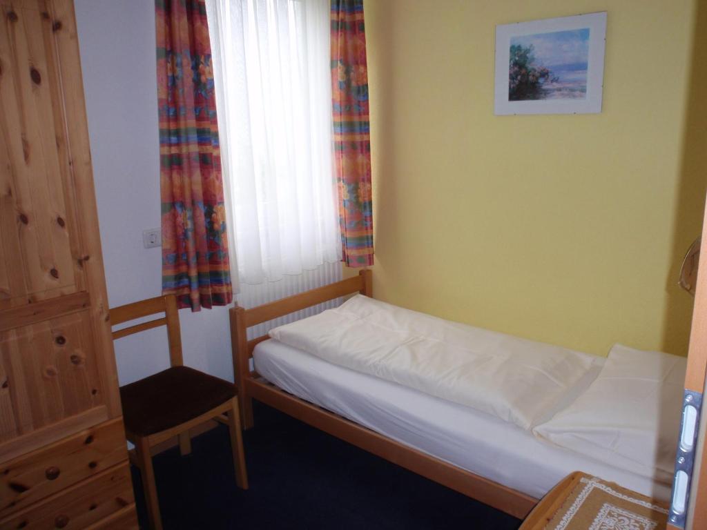 Postel nebo postele na pokoji v ubytování Pension ALPENHAUS