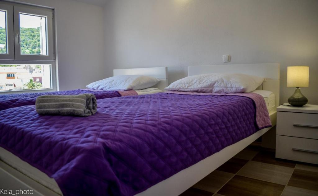 Postel nebo postele na pokoji v ubytování Galeb 2