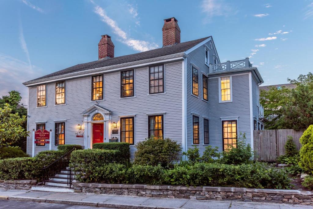 a white house with a red door at Samuel Durfee House in Newport