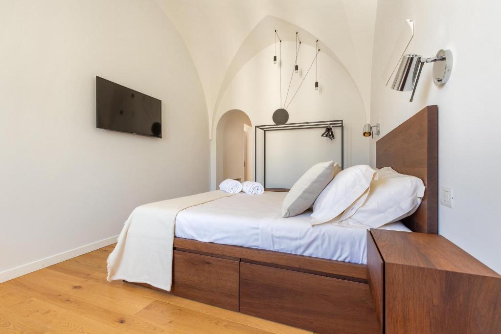 Postel nebo postele na pokoji v ubytování Palazzo Mascetti