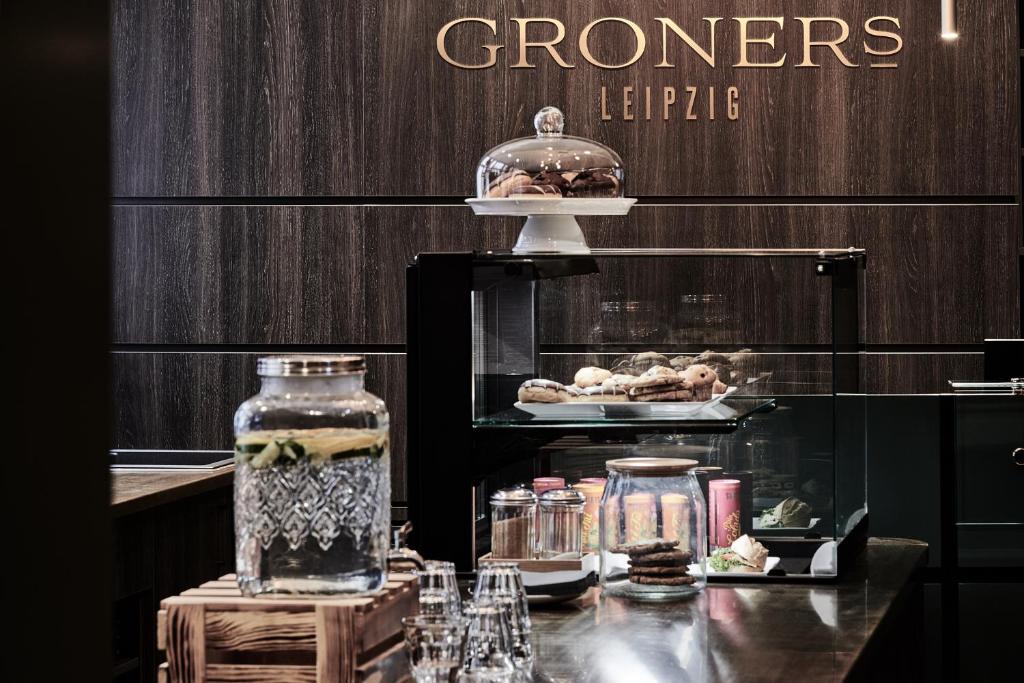 a display case with food and other items on a table at GRONERS Leipzig City Center in Leipzig